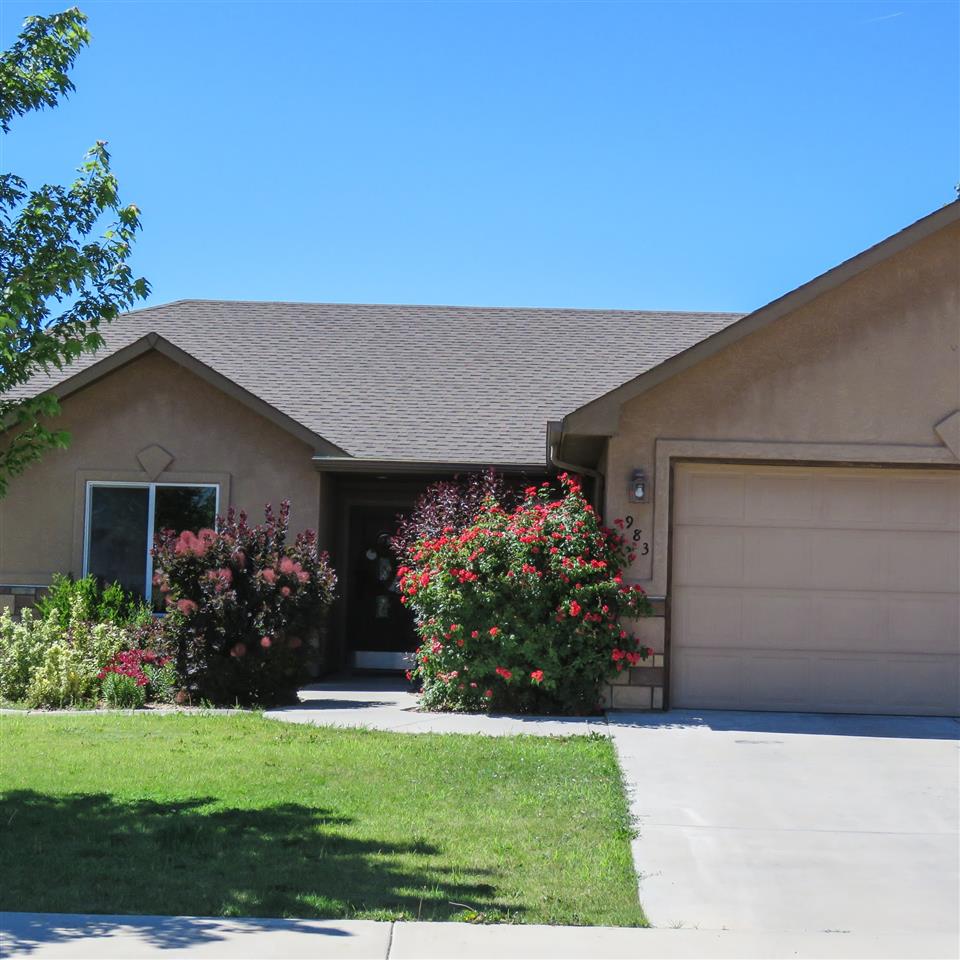 983 Kaley Street Fruita, CO 81521 - Photo 15 of 28 a front view of house with a yard