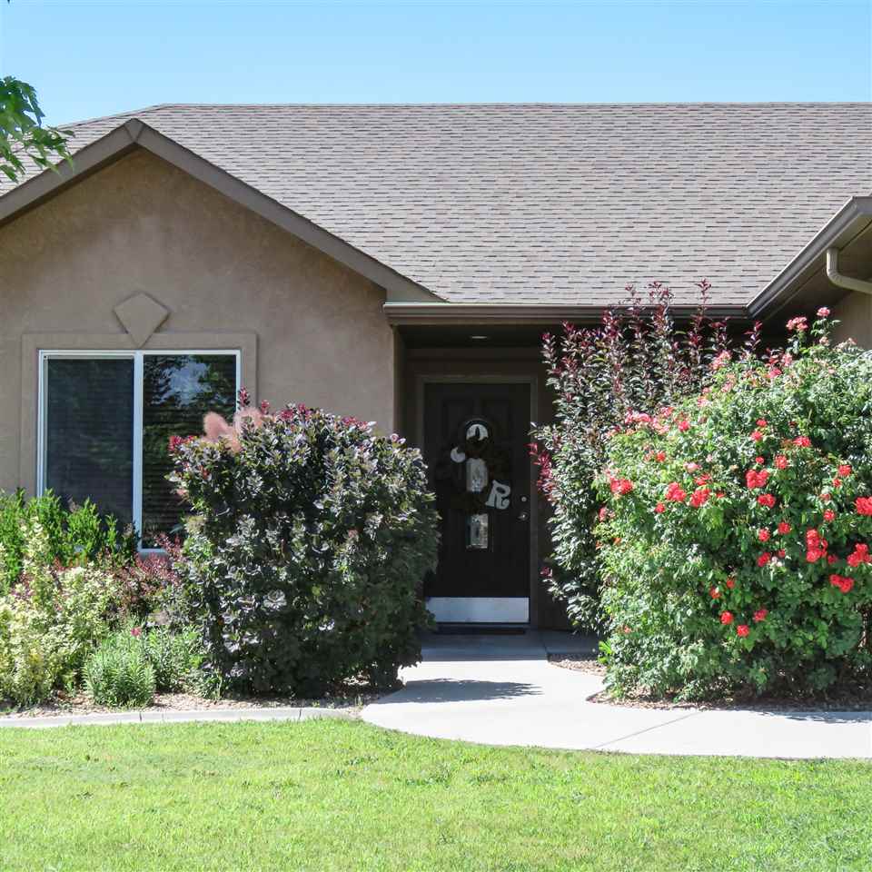 983 Kaley Street Fruita, CO 81521 - Photo 20 of 28 front view of a house with a yard