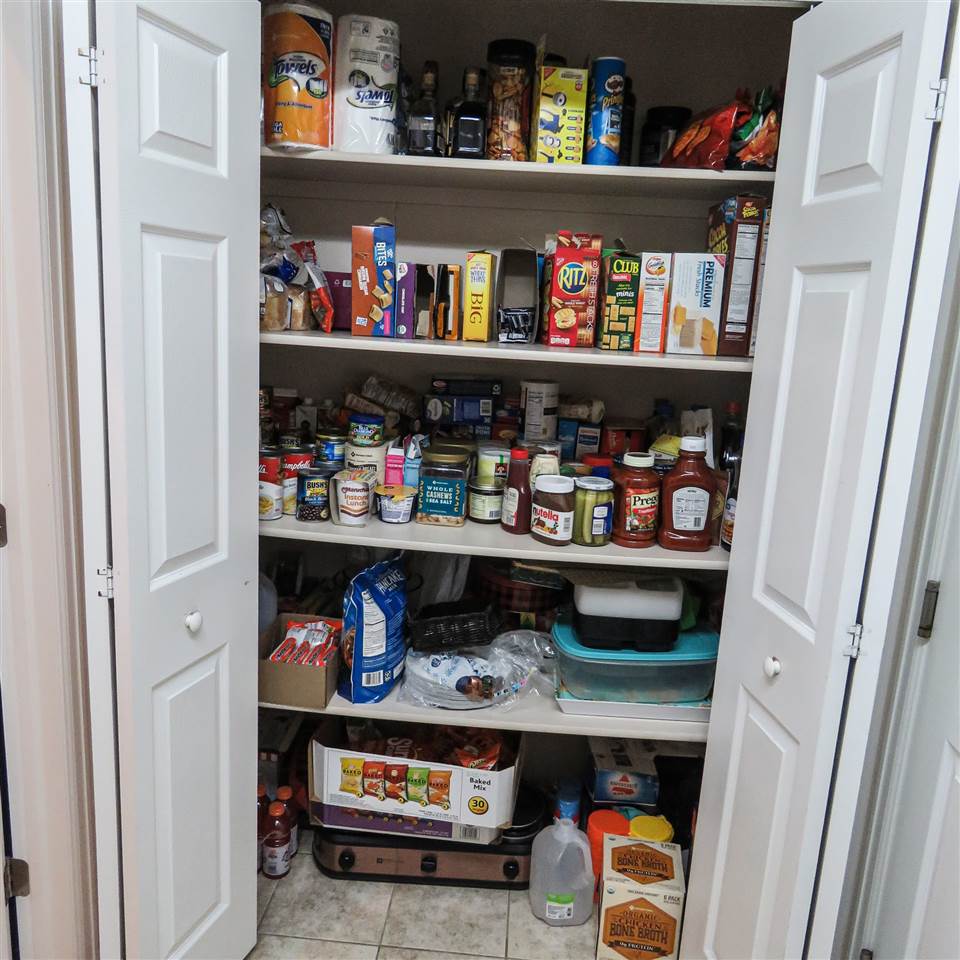 983 Kaley Street Fruita, CO 81521 - Photo 23 of 28 a room with storage and utility