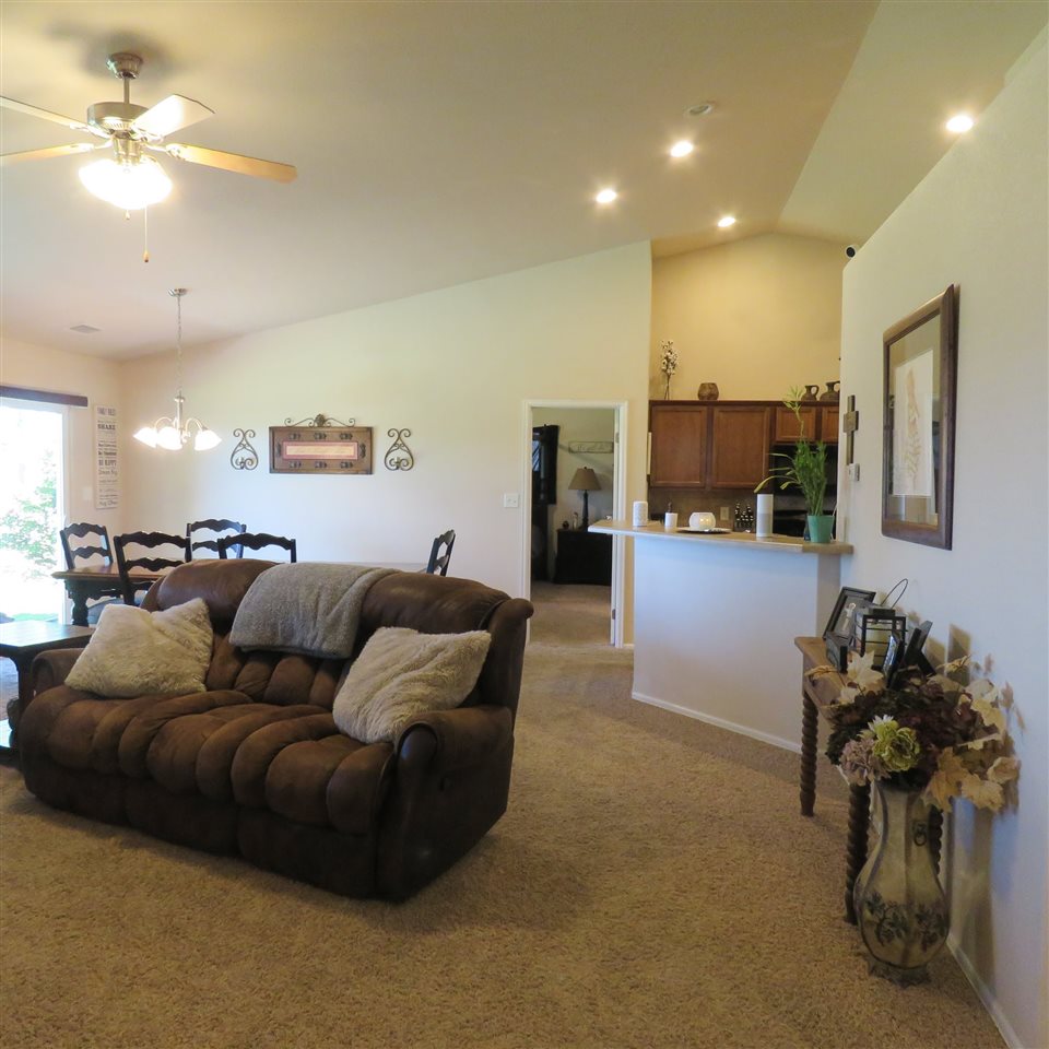 983 Kaley Street Fruita, CO 81521 - Photo 24 of 28 a living room with furniture and kitchen view