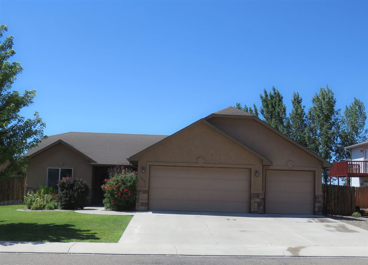983 Kaley Street Fruita, CO 81521 - Photo 28 of 28 a front view of a house with a yard