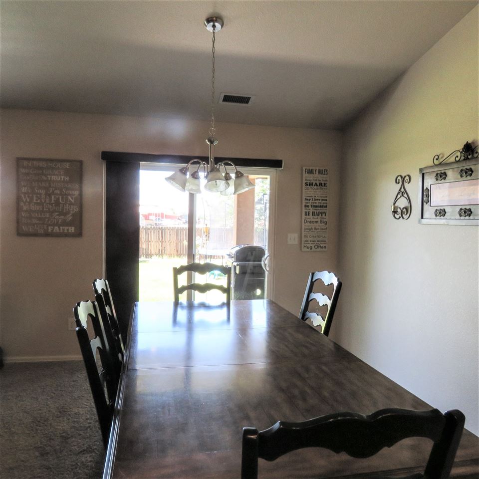 983 Kaley Street Fruita, CO 81521 - Photo 4 of 28 a view of a dining room with furniture window and outside view