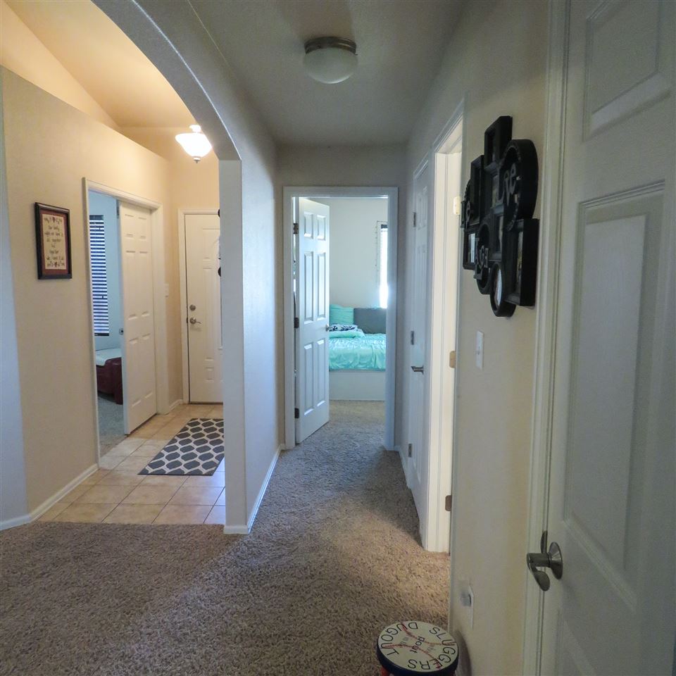 983 Kaley Street Fruita, CO 81521 - Photo 10 of 28 a view of a hallway with closet and bathroom