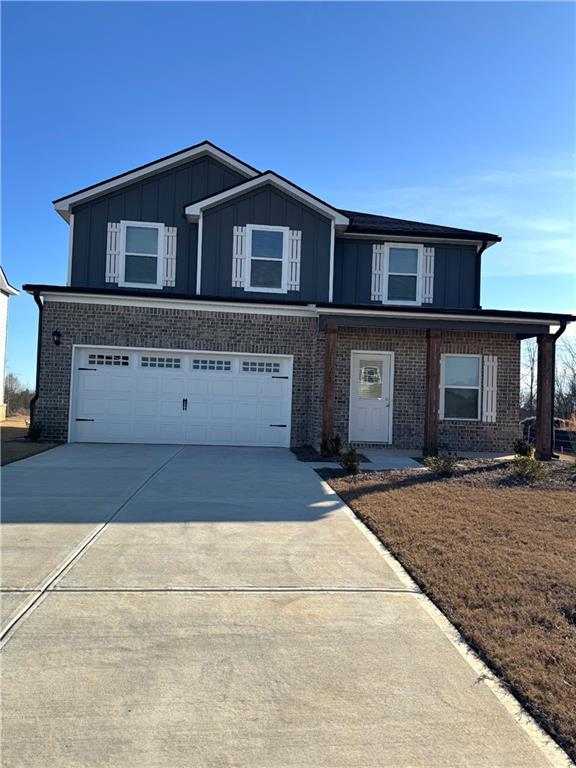 11075 Suria Drive Covington, GA 30014 - Photo 1 of 12 a front view of a house with a yard