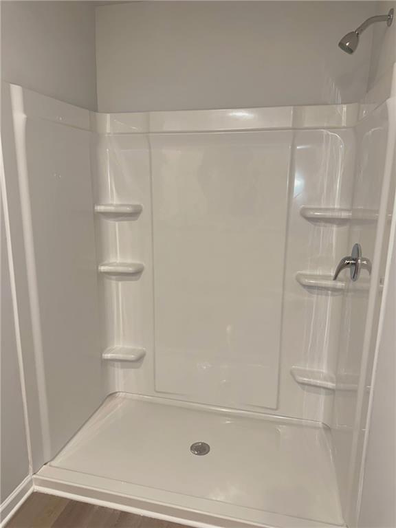 11075 Suria Drive Covington, GA 30014 - Photo 12 of 12 a bathroom with a shower