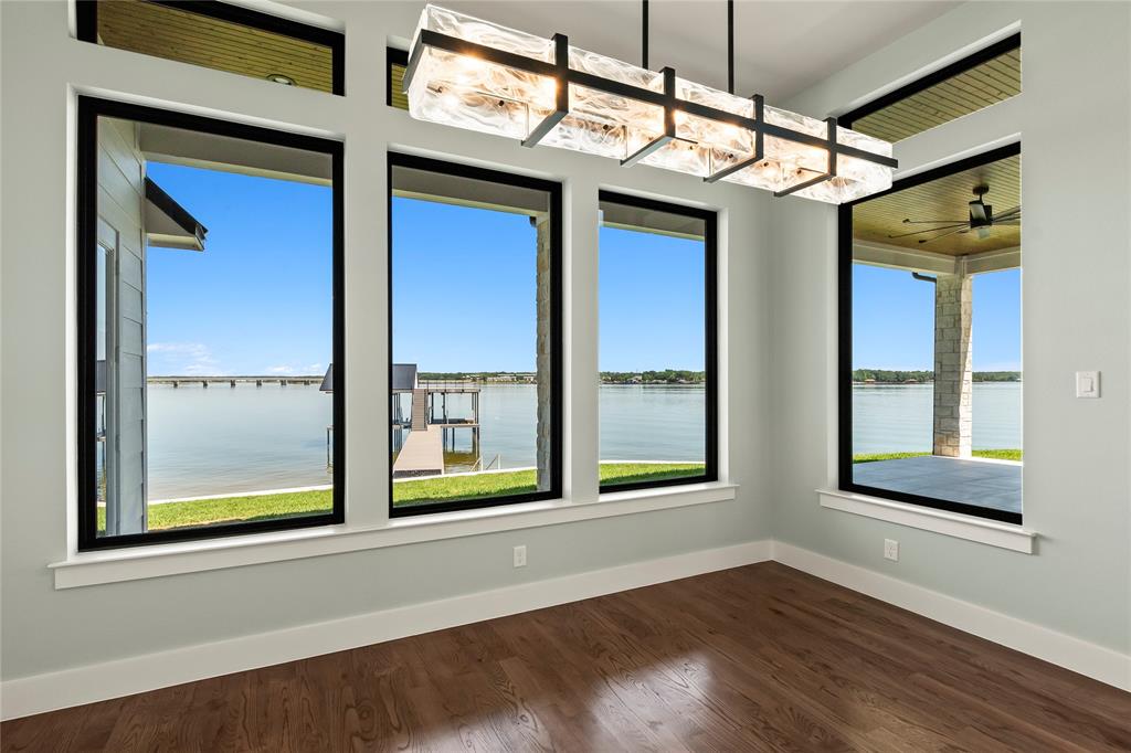4054 Smothers Road Caney City, TX 75148 - Photo 7 of 40 Lakeside dining with expansive windows overlooking the water.