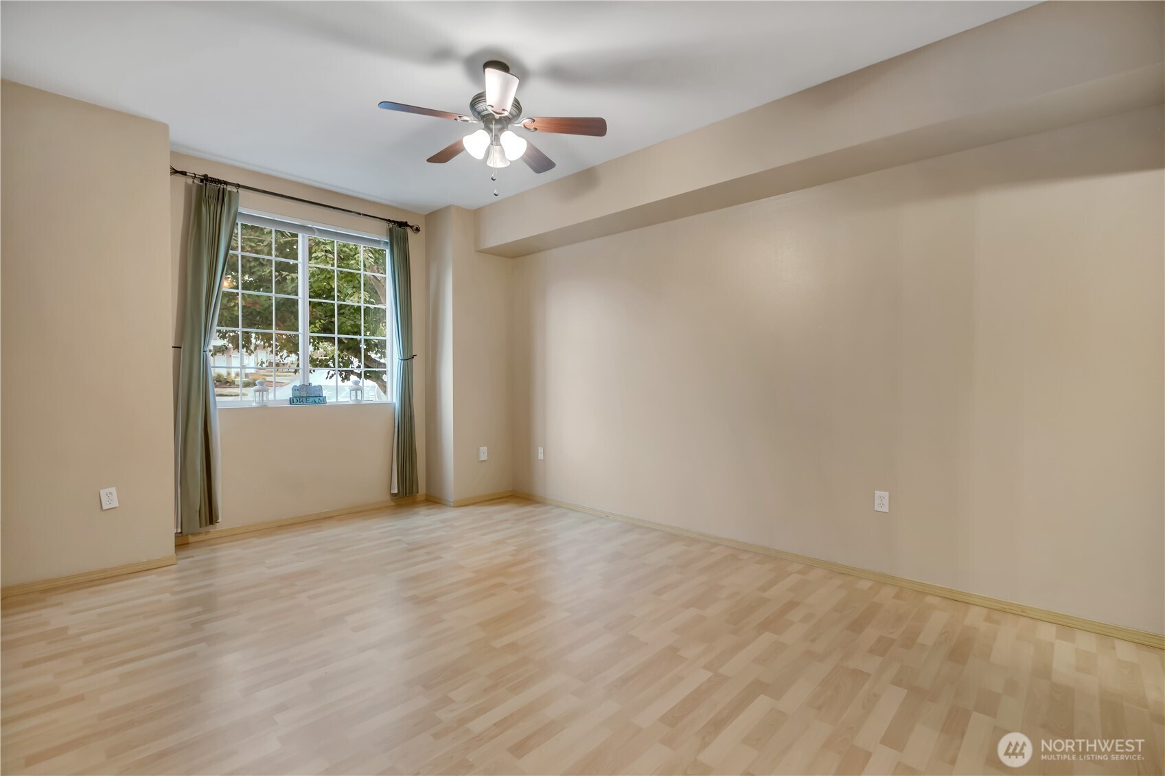 3012 Southeast 8th Place, Unit 1117 Renton, WA 98058 - Photo 13 of 28 a view of an empty room with a window