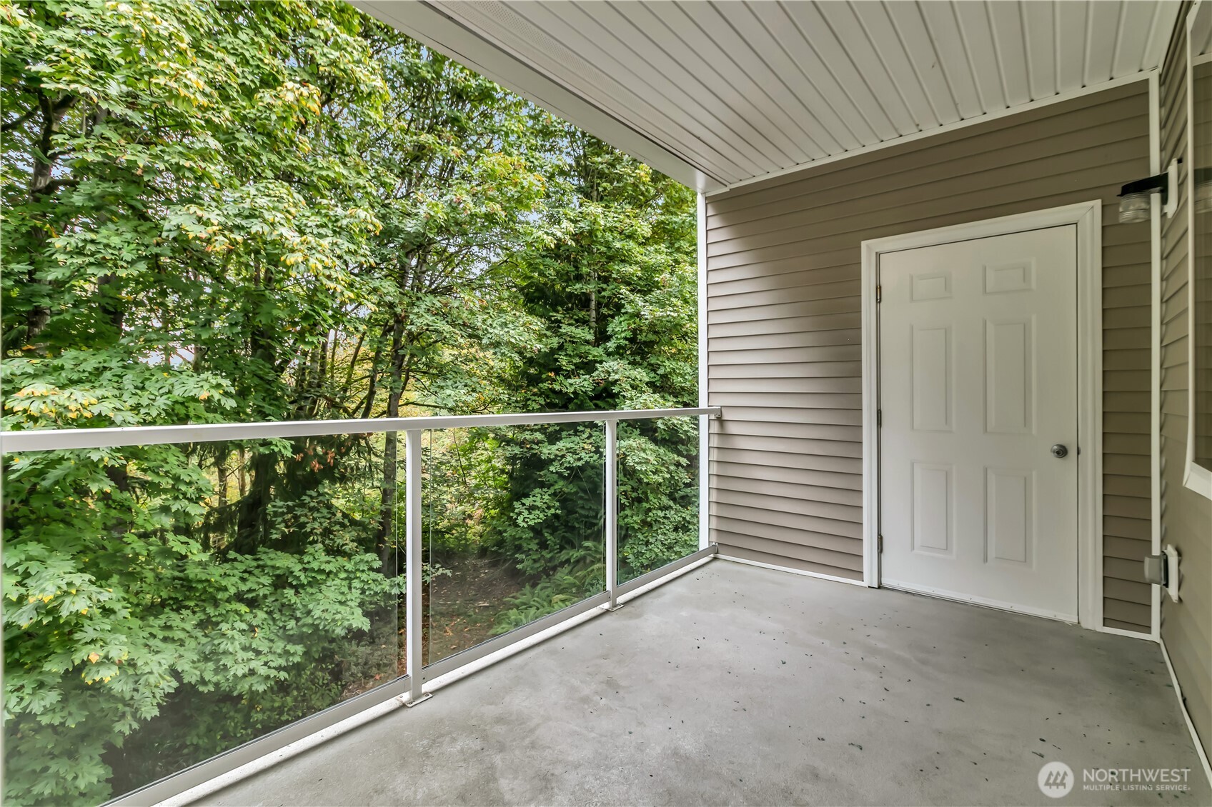 3012 Southeast 8th Place, Unit 1117 Renton, WA 98058 - Photo 19 of 28 a view of a deck with a backyard