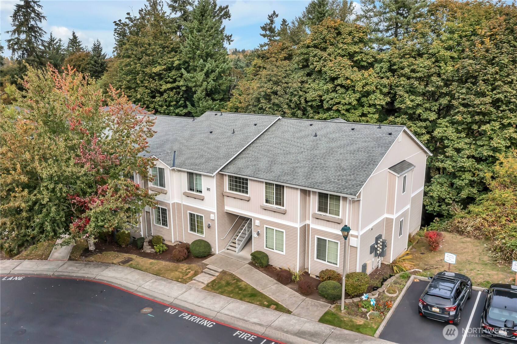 3012 Southeast 8th Place, Unit 1117 Renton, WA 98058 - Photo 25 of 28 a aerial view of a white building among the street with palm trees