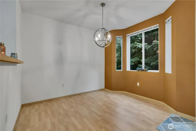 a view of an empty room with windows