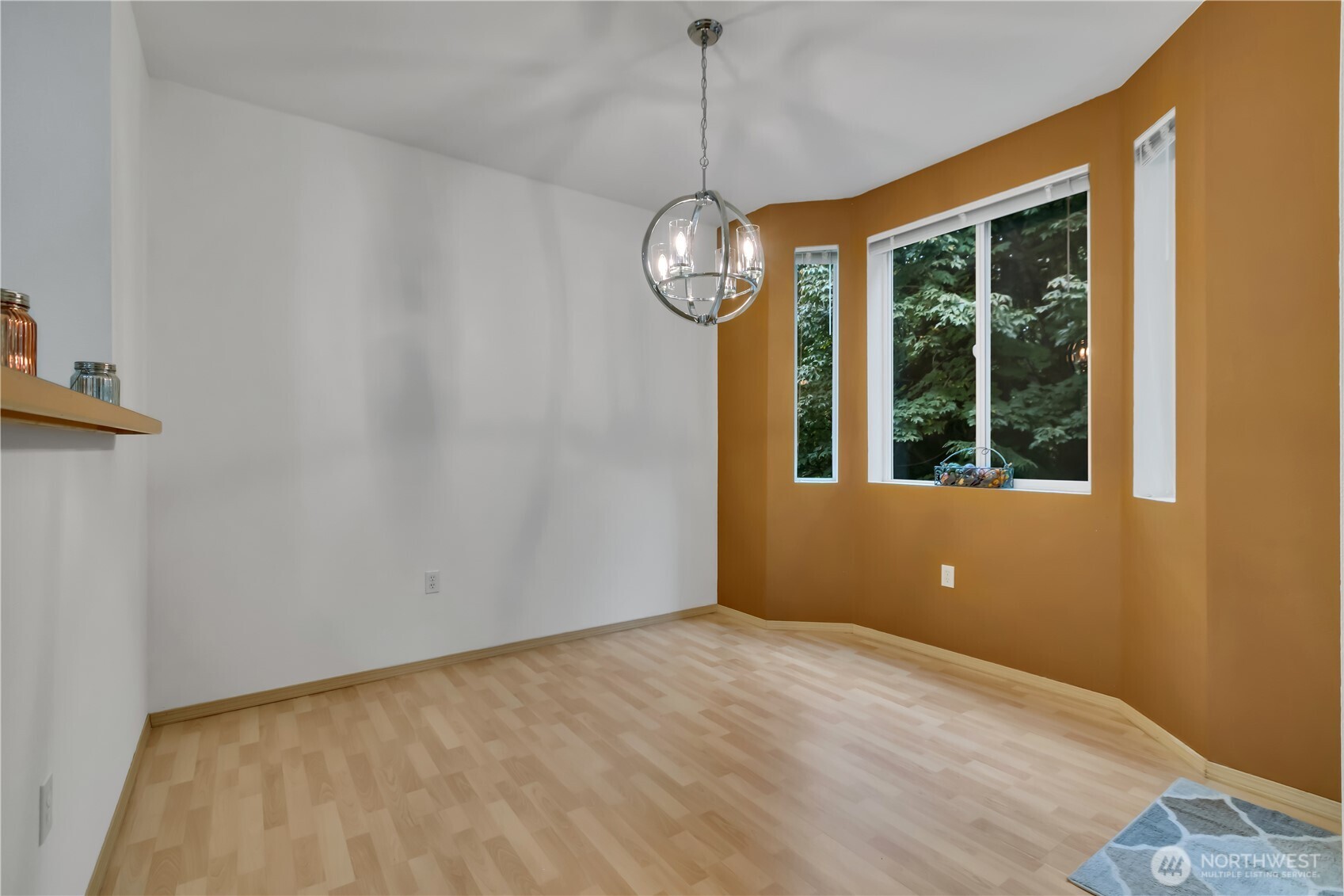 3012 Southeast 8th Place, Unit 1117 Renton, WA 98058 - Photo 7 of 28 a view of an empty room with windows