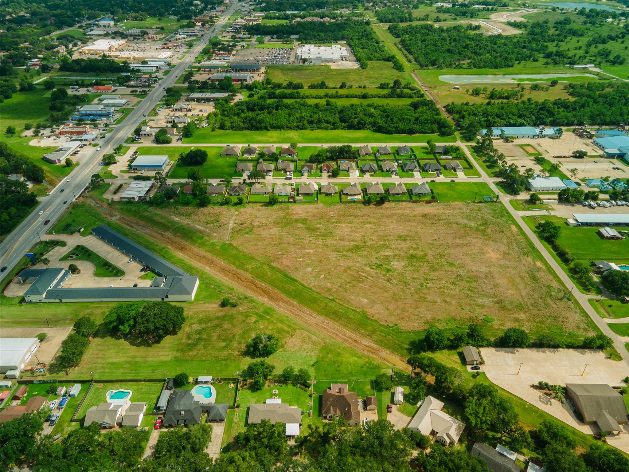 0 Karankawa Street Angleton, TX 77515 - Photo 8 of 22 a view of a yard with plants