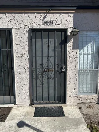 a view of a house with a parking space