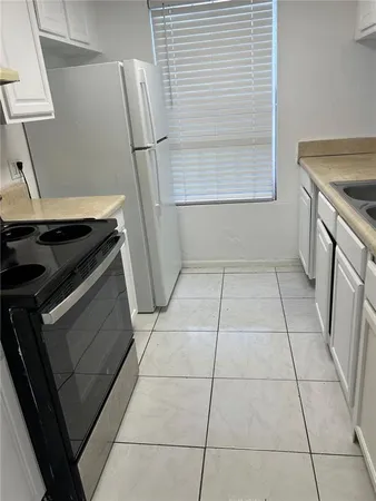 a bathroom with a sink vanity mirror and toilet