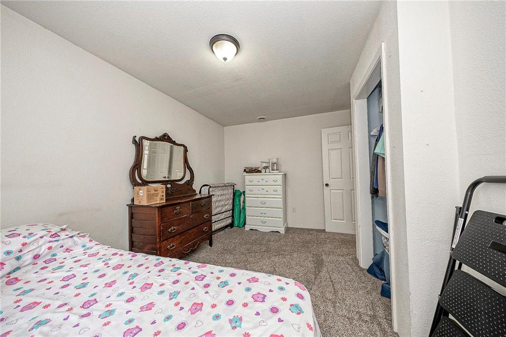 249 Washington Road, Unit 3 Waynesburg, PA 15370 - Photo 5 of 10 a bedroom with a bed and a dresser in it