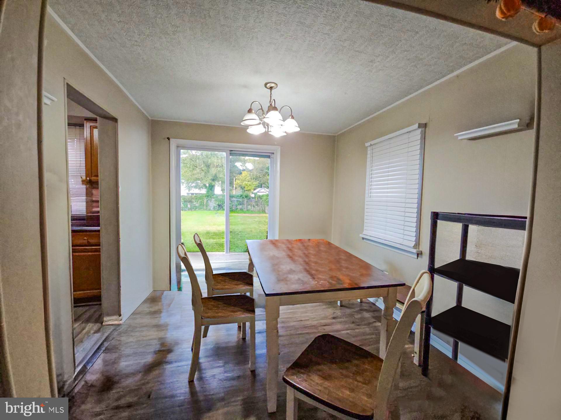 39 Maplewood Avenue Carneys Point, NJ 08069 - Photo 3 of 9 a view of a dining room with furniture window and wooden floor