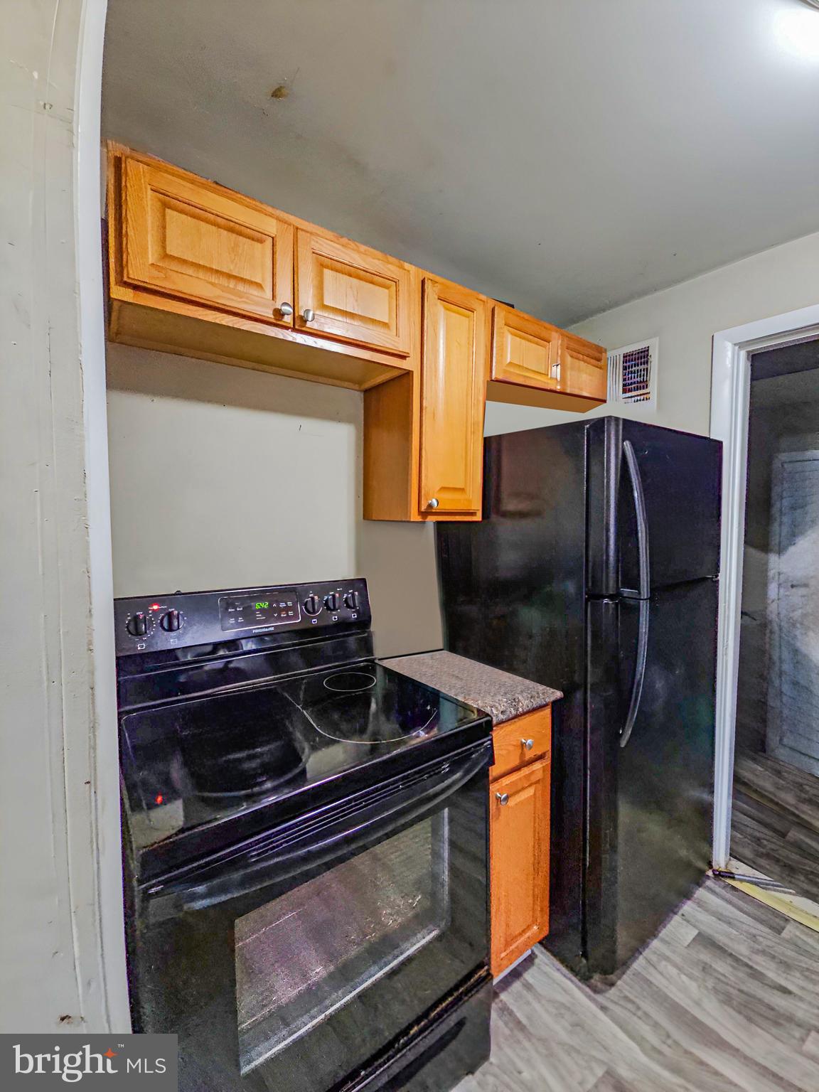 39 Maplewood Avenue Carneys Point, NJ 08069 - Photo 4 of 9 a kitchen with a stove and a refrigerator