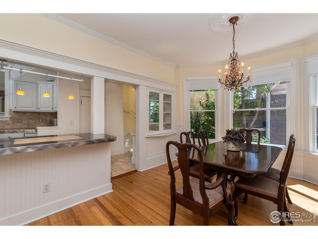 1063 Mapleton Avenue Boulder, CO 80304 - Photo 13 of 38 a dining room with furniture and window