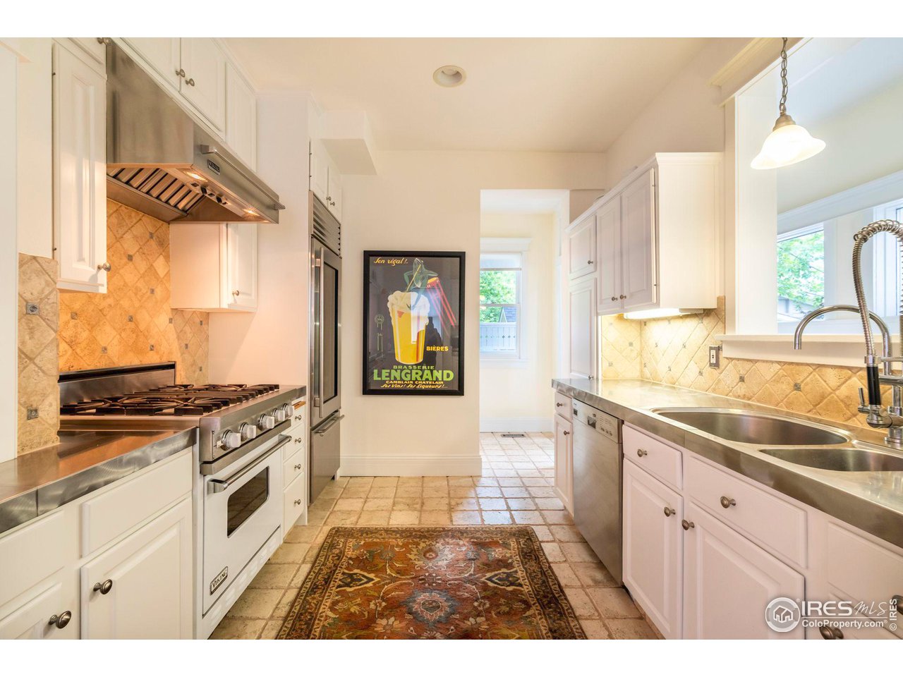 1063 Mapleton Avenue Boulder, CO 80304 - Photo 15 of 38 a kitchen with stainless steel appliances granite countertop a sink and cabinets