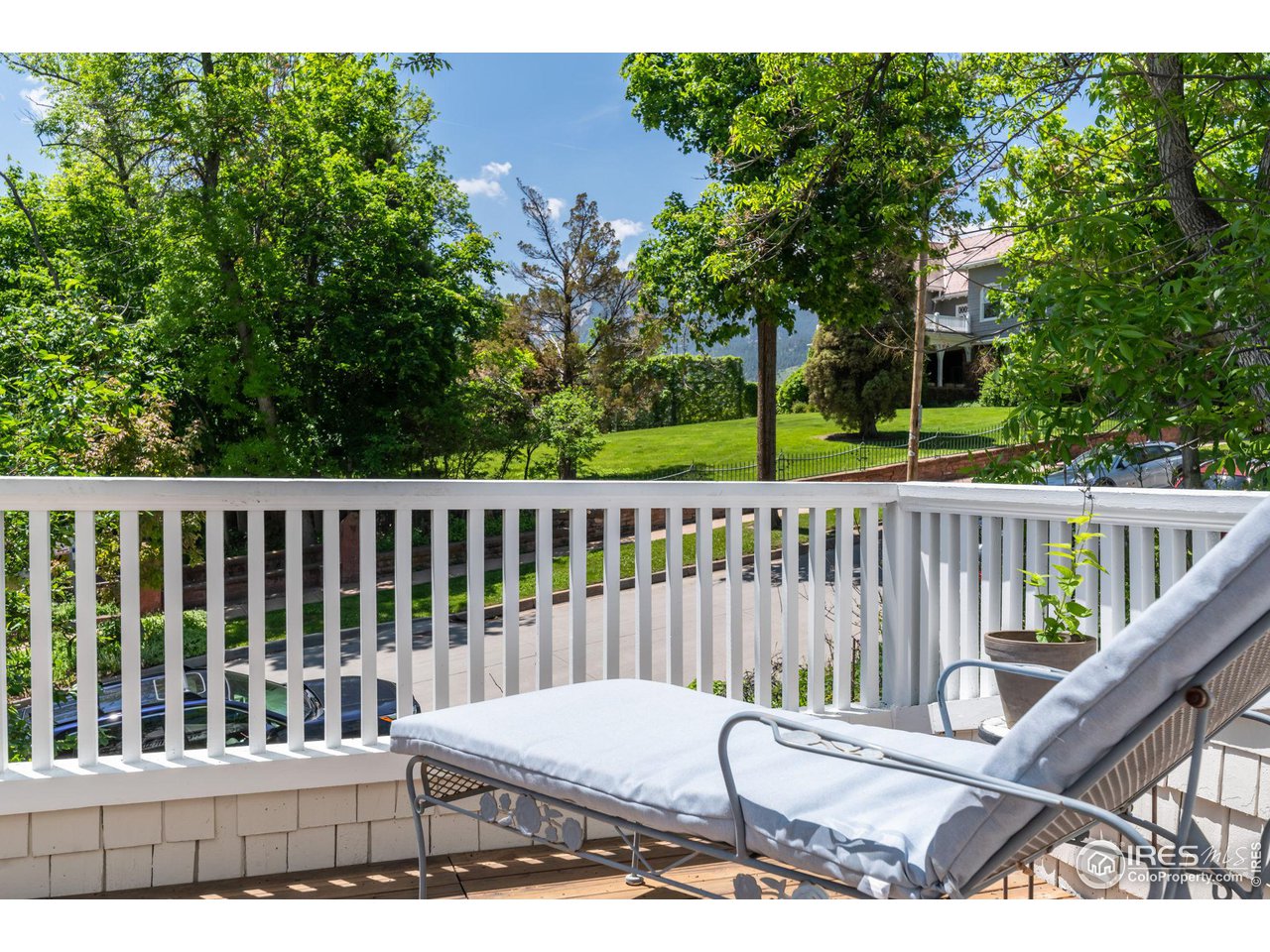 1063 Mapleton Avenue Boulder, CO 80304 - Photo 25 of 38 a view of a chair and table in the wooden deck