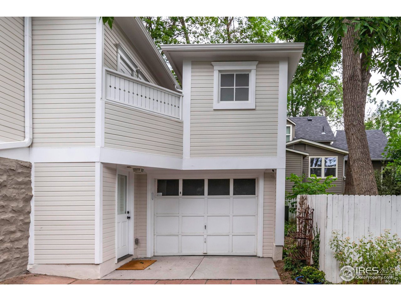 1063 Mapleton Avenue Boulder, CO 80304 - Photo 31 of 38 a view of a house with a door and a large window