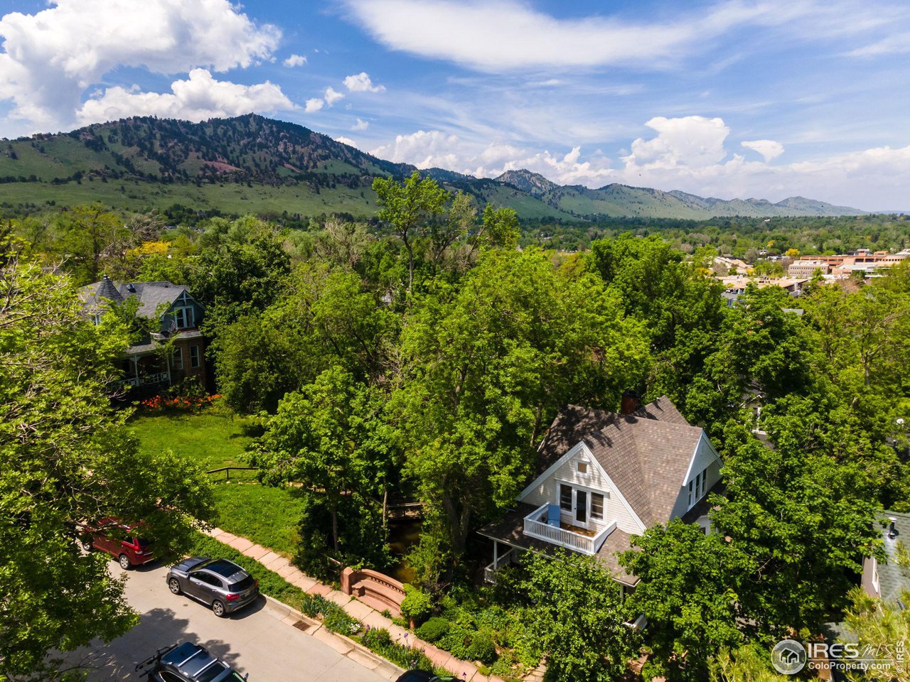 1063 Mapleton Avenue Boulder, CO 80304 - Photo 35 of 38 a view of a house with a yard and lake view