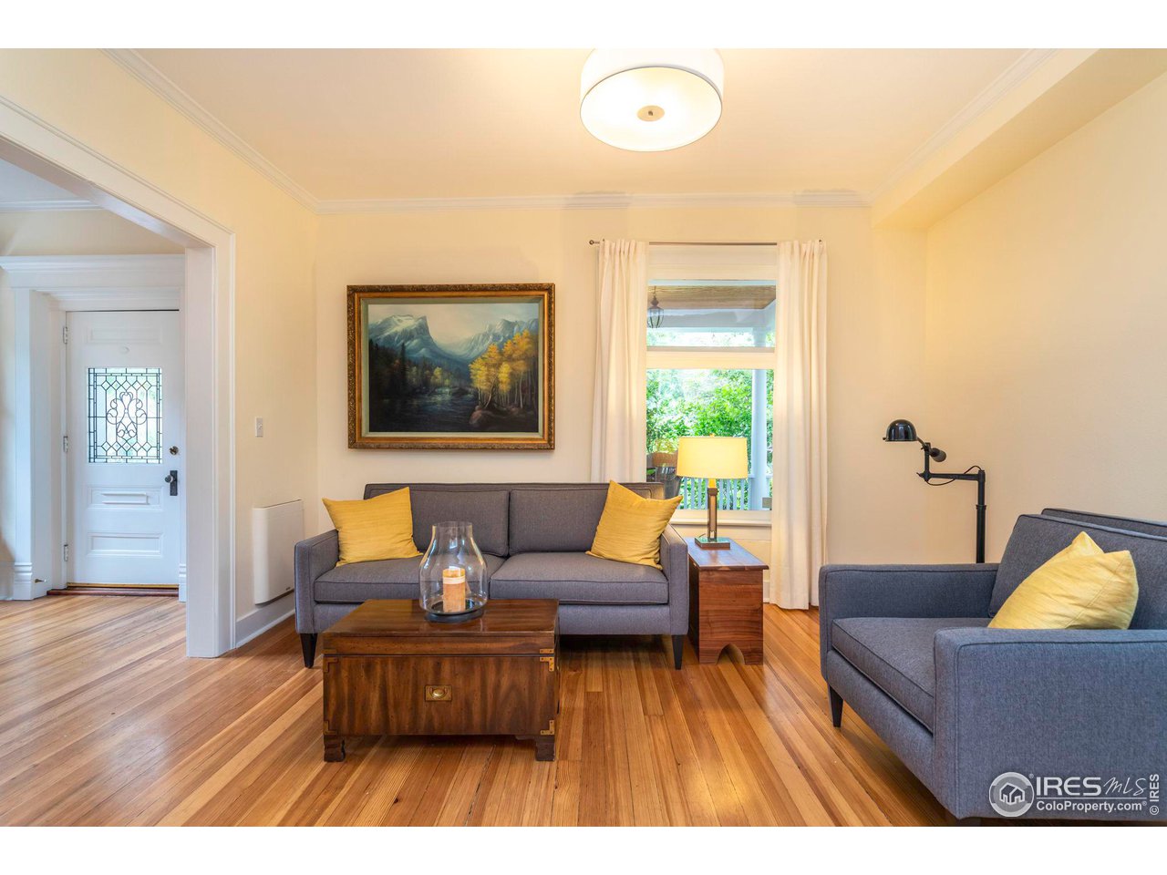 1063 Mapleton Avenue Boulder, CO 80304 - Photo 10 of 38 a living room with furniture and a large window