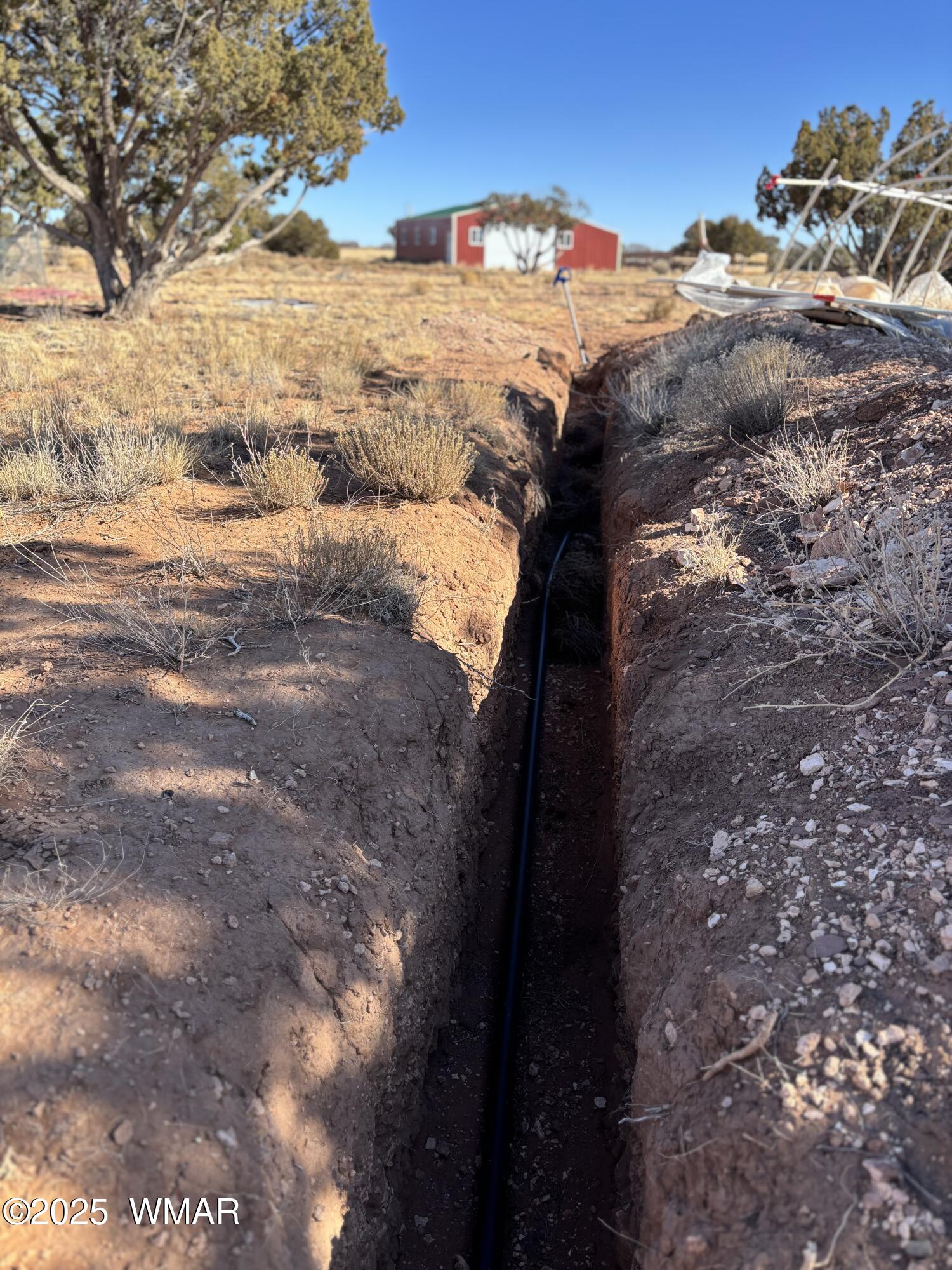 5985 Cow Bell Road Heber, AZ 85928 - Photo 13 of 26 Trench with Laid Pipe