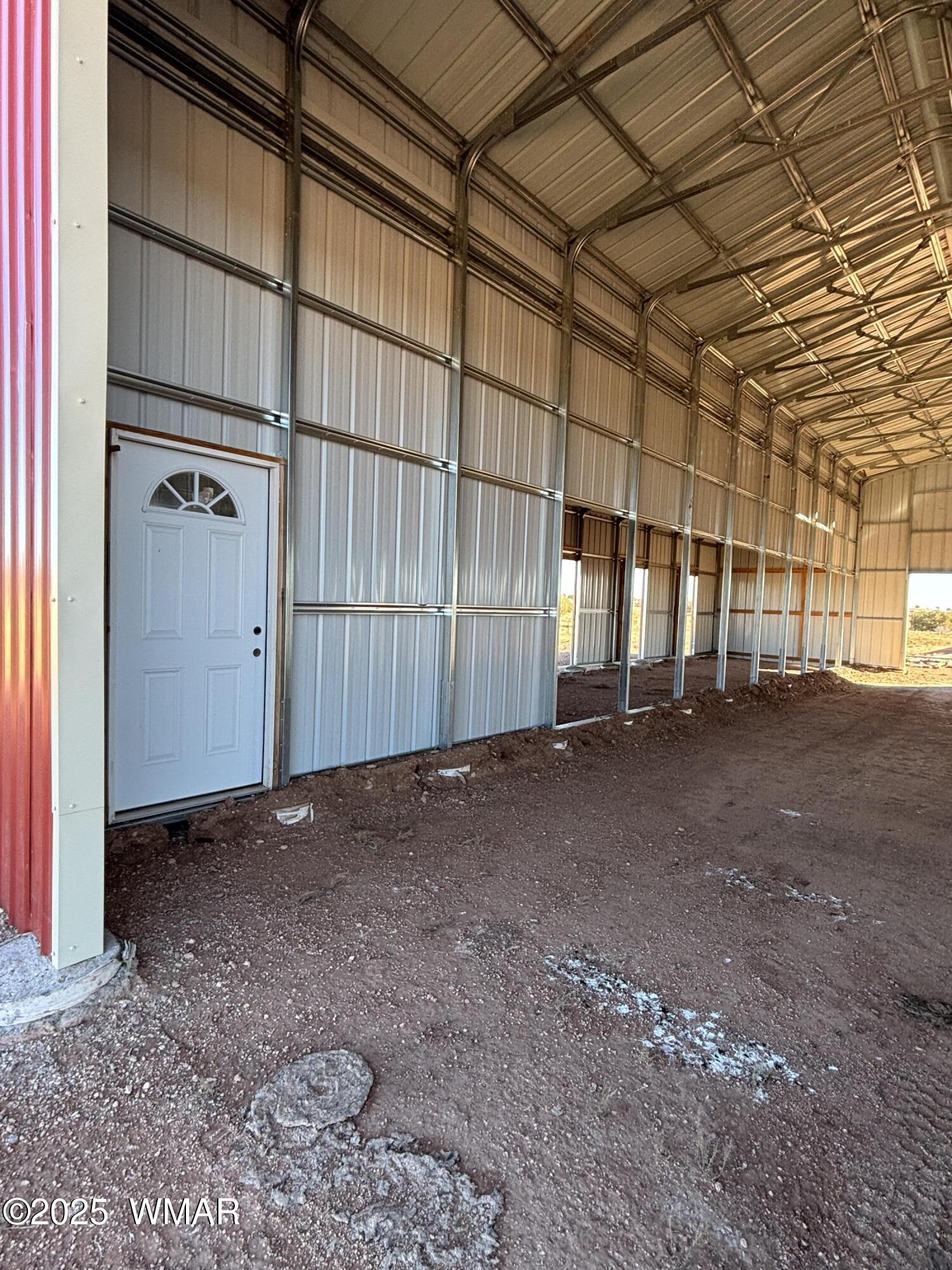 5985 Cow Bell Road Heber, AZ 85928 - Photo 5 of 26 Inside Horse Barn East Side