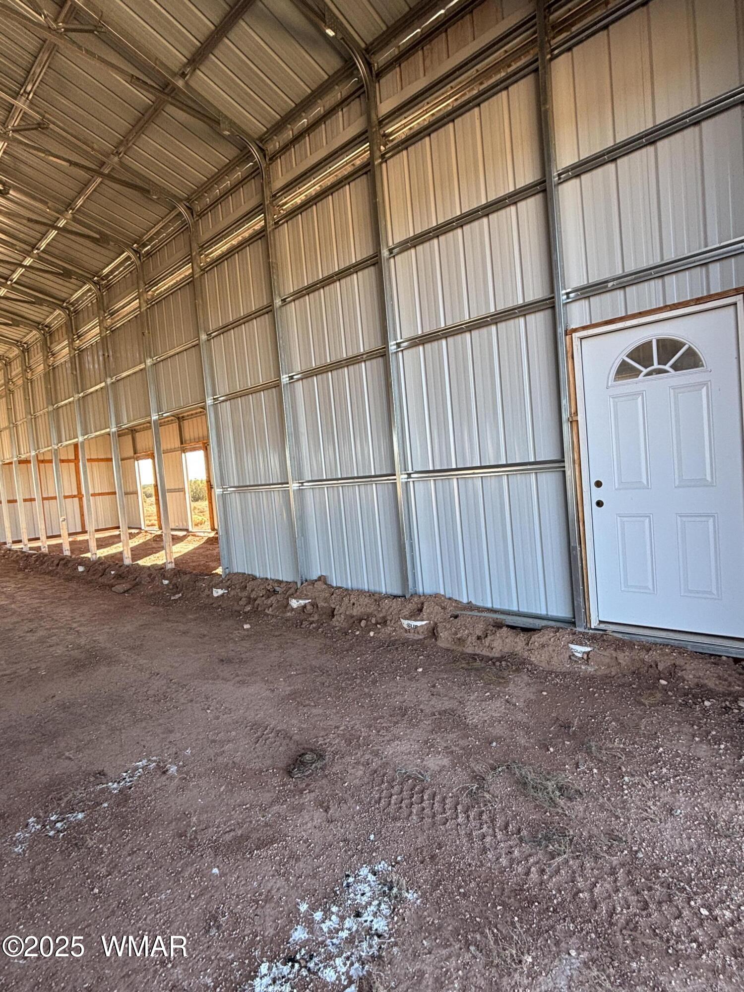 5985 Cow Bell Road Heber, AZ 85928 - Photo 7 of 26 Inside Horse Barn West Side