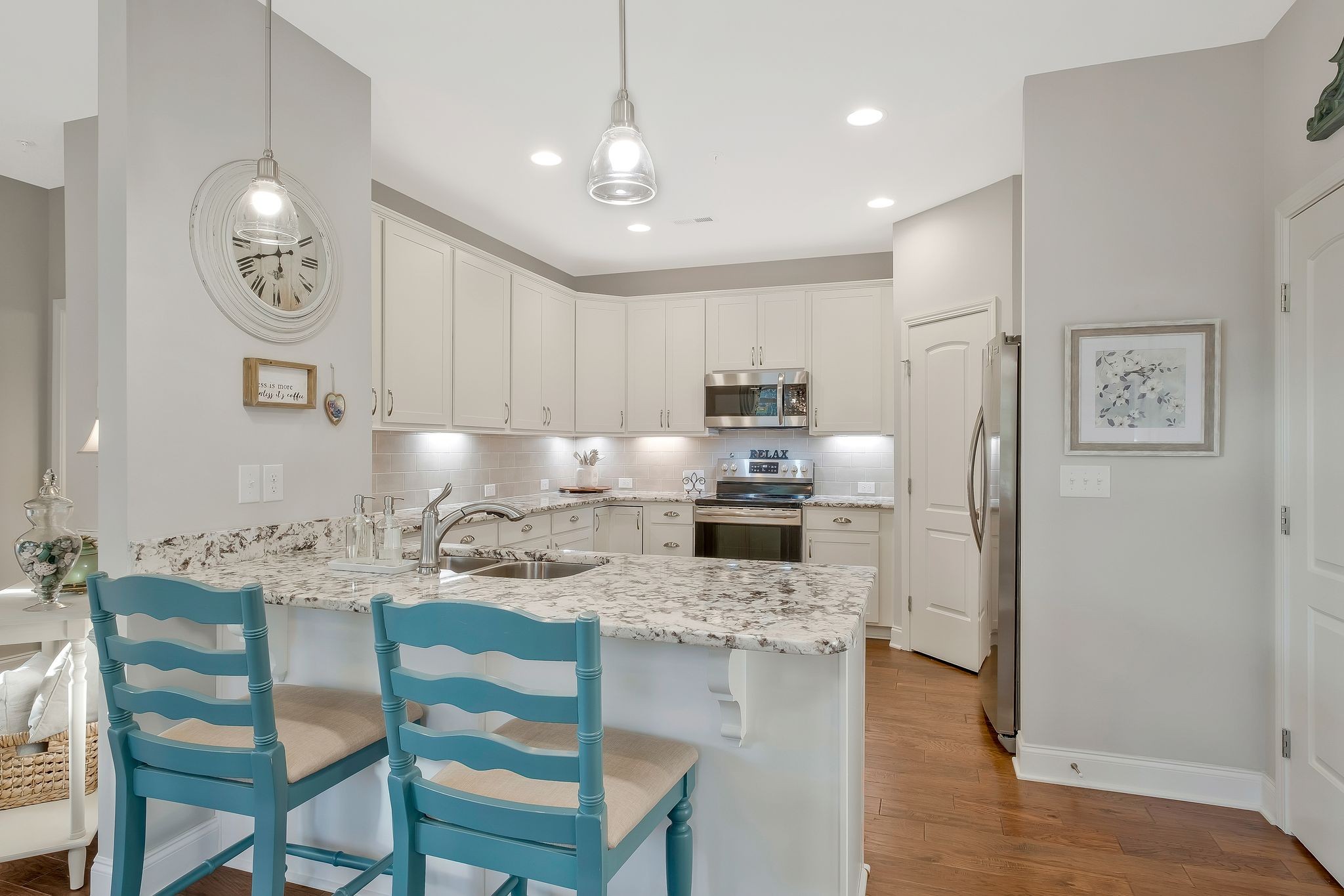 100 Jane Crossing Mount Juliet, TN 37122 - Photo 12 of 33 a kitchen with kitchen island granite countertop a sink cabinets and stainless steel appliances