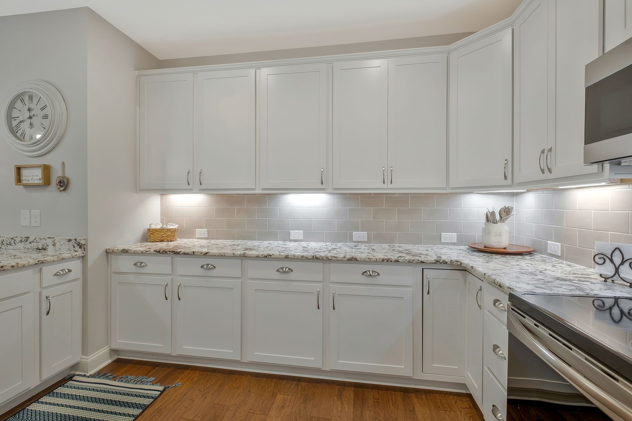 100 Jane Crossing Mount Juliet, TN 37122 - Photo 14 of 33 a kitchen with granite countertop white cabinets and sink
