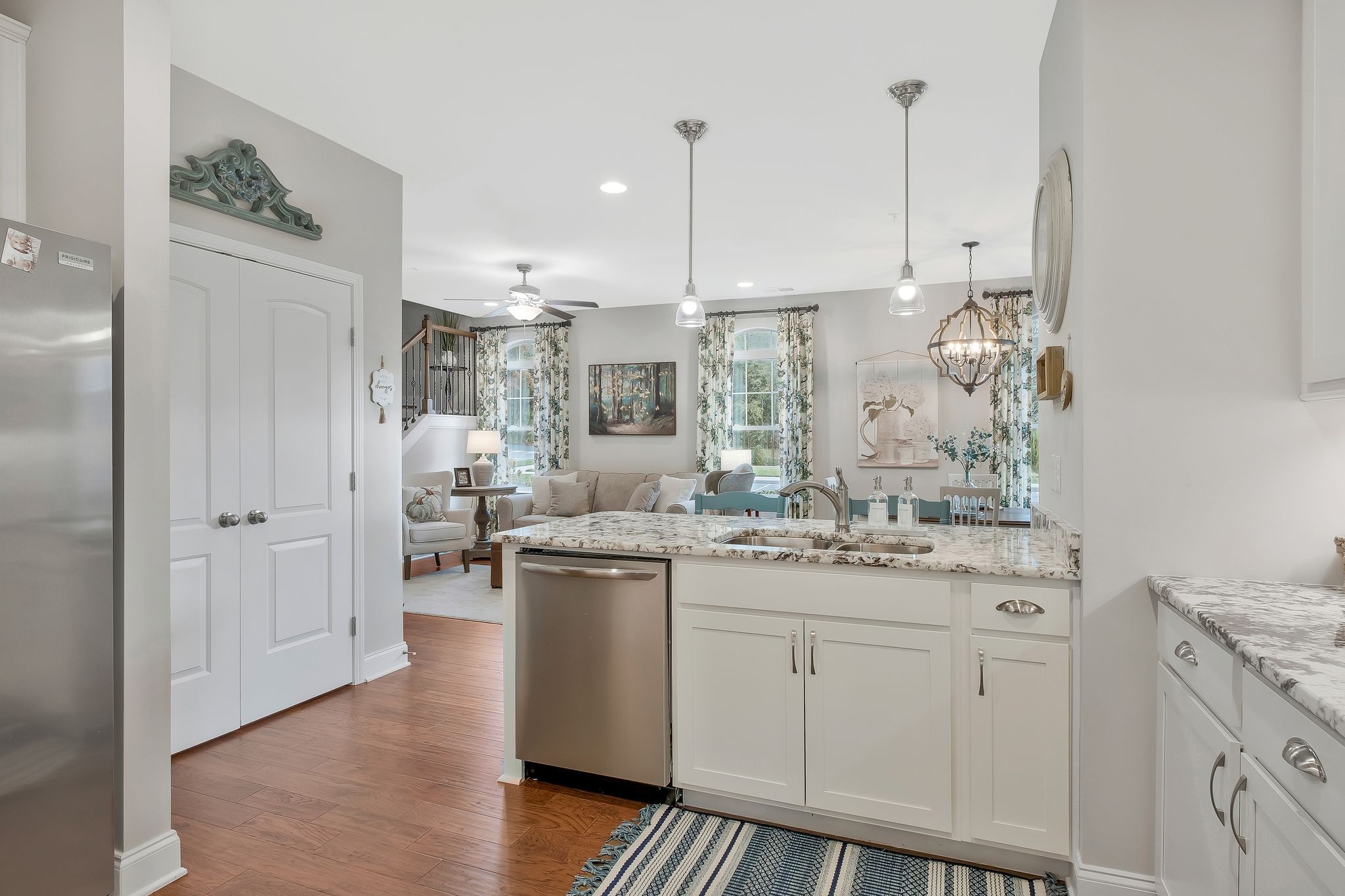 100 Jane Crossing Mount Juliet, TN 37122 - Photo 15 of 33 a kitchen with kitchen island white cabinets and white appliances