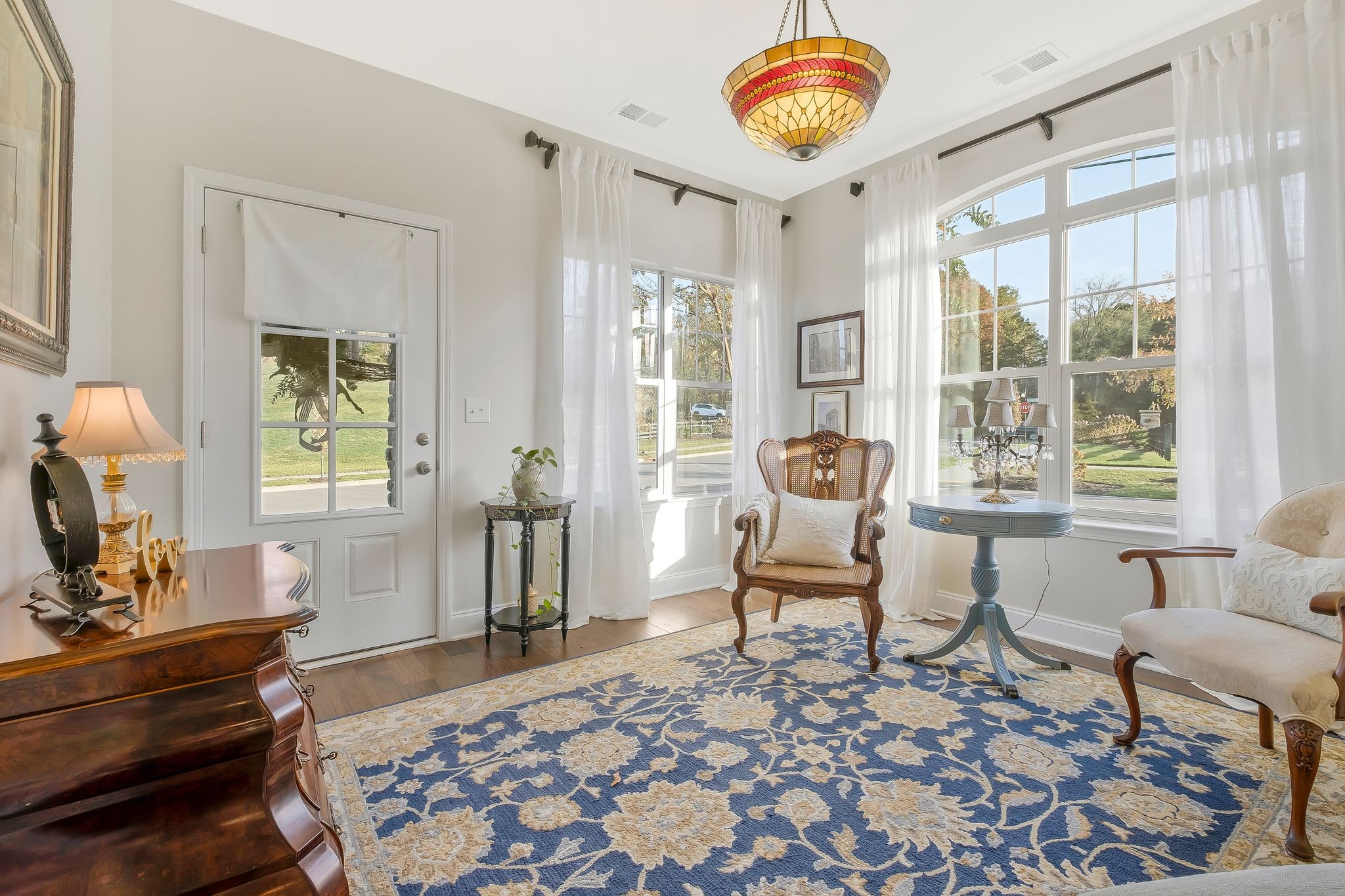 100 Jane Crossing Mount Juliet, TN 37122 - Photo 6 of 33 a living room with furniture a fireplace and a table