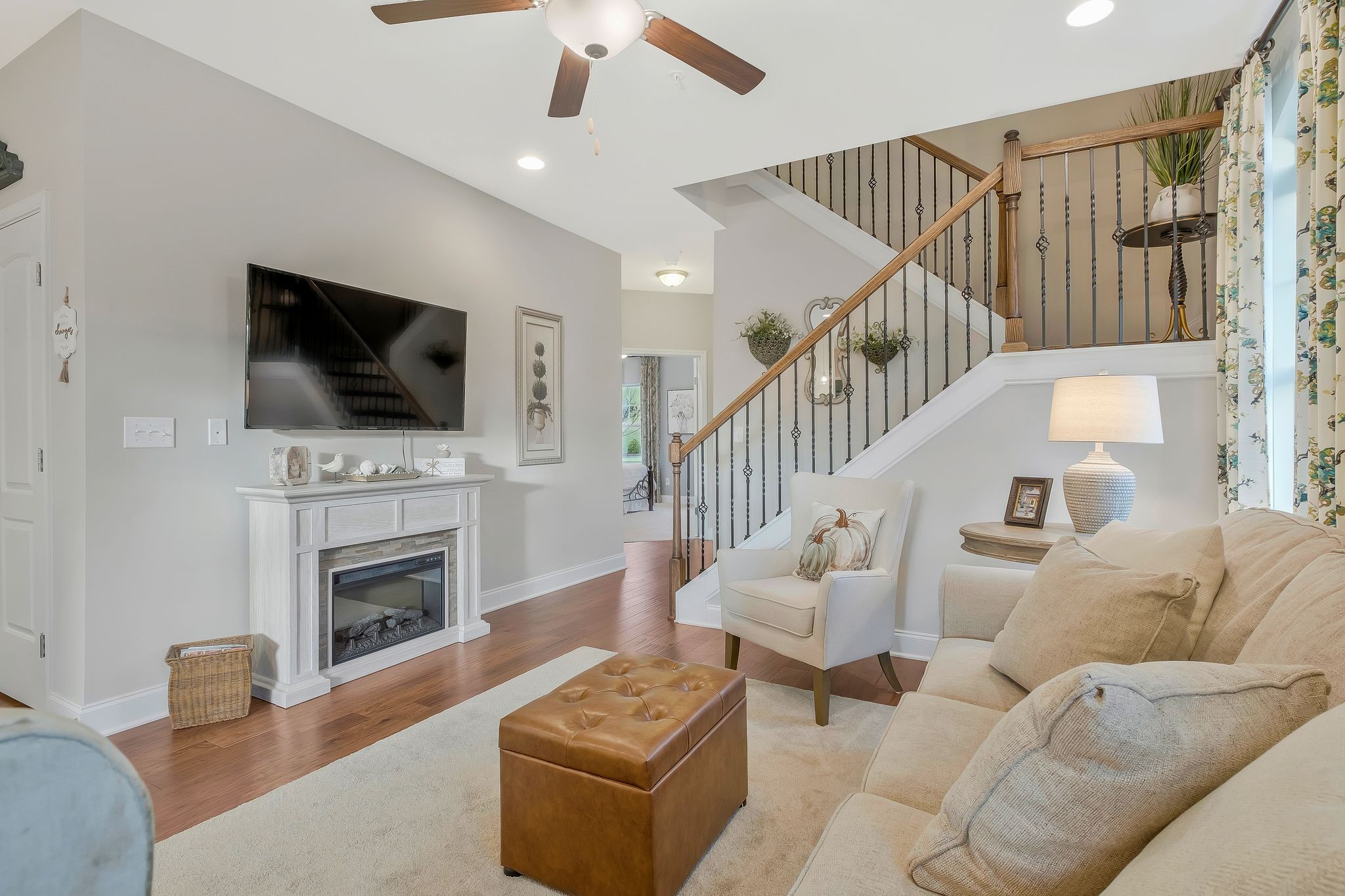 100 Jane Crossing Mount Juliet, TN 37122 - Photo 9 of 33 a living room with furniture a flat screen tv and a fireplace