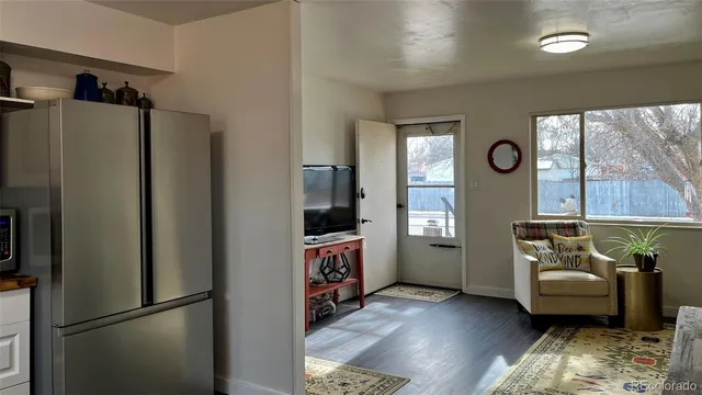 a kitchen with a refrigerator and a stove