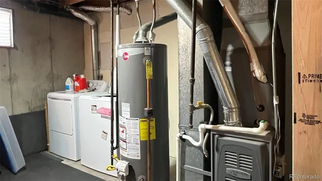 a view of a hallway with furniture and wooden floor