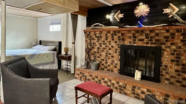 a bedroom with a bed and a mirror