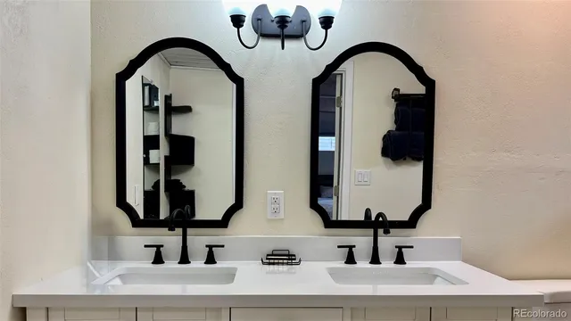 a view of a house with a small yard and sitting area