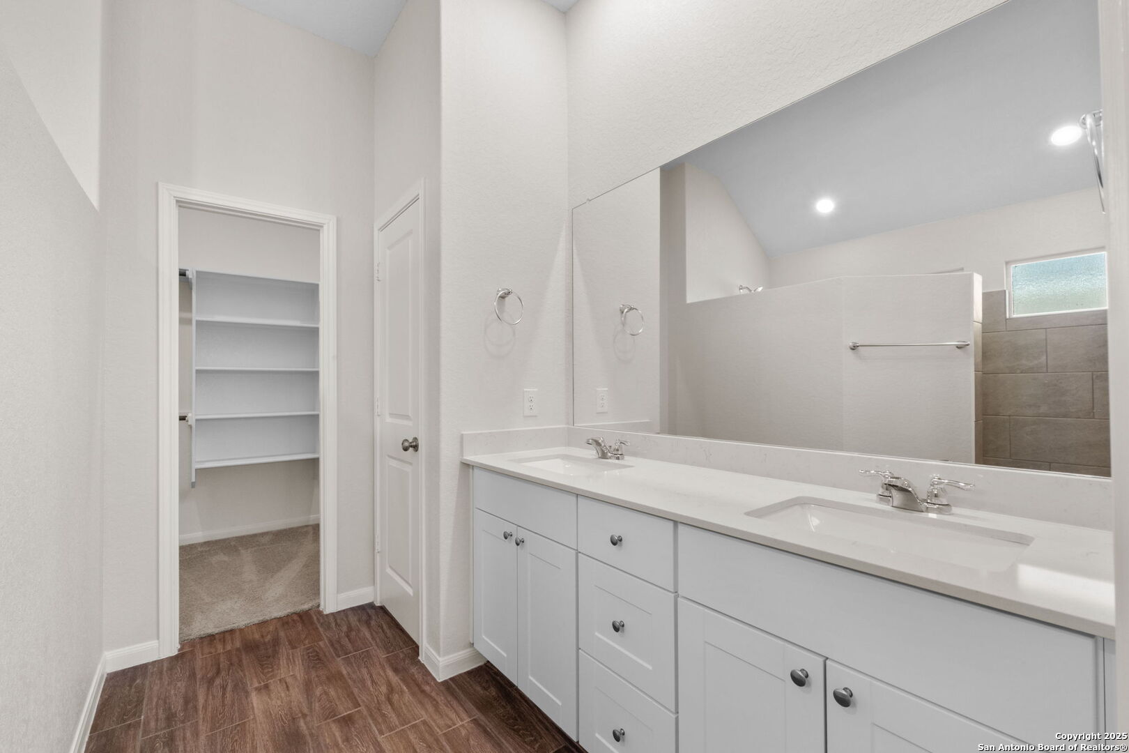 6056 Draw Loop Bulverde, TX 78163 - Photo 27 of 36 a bathroom with a sink double vanity and a mirror
