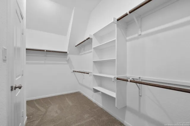 a view of an empty walk in closet