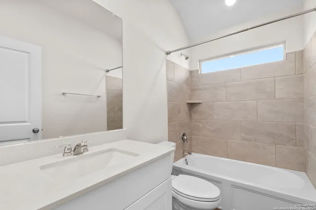 a bathroom with a sink a toilet and a bathtub