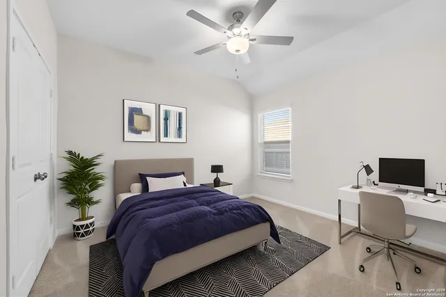 a bedroom with a large bed and a window