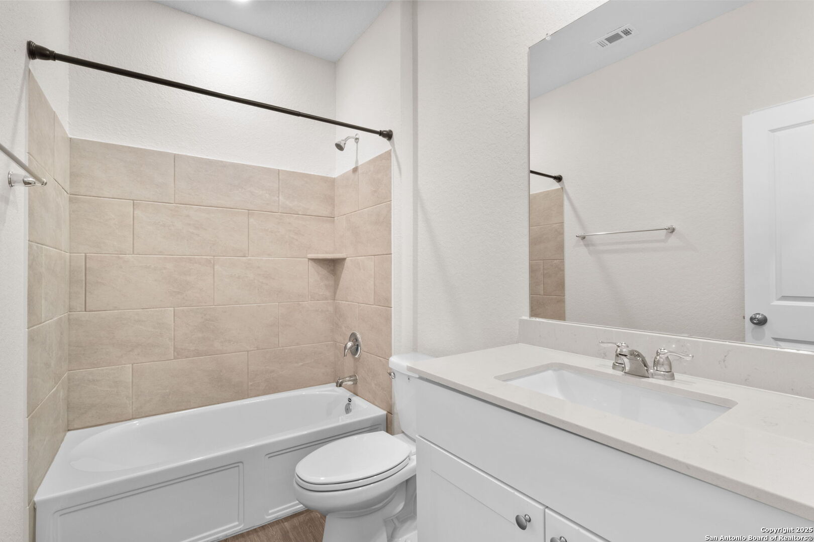 6056 Draw Loop Bulverde, TX 78163 - Photo 9 of 36 a bathroom with a granite countertop sink toilet and shower