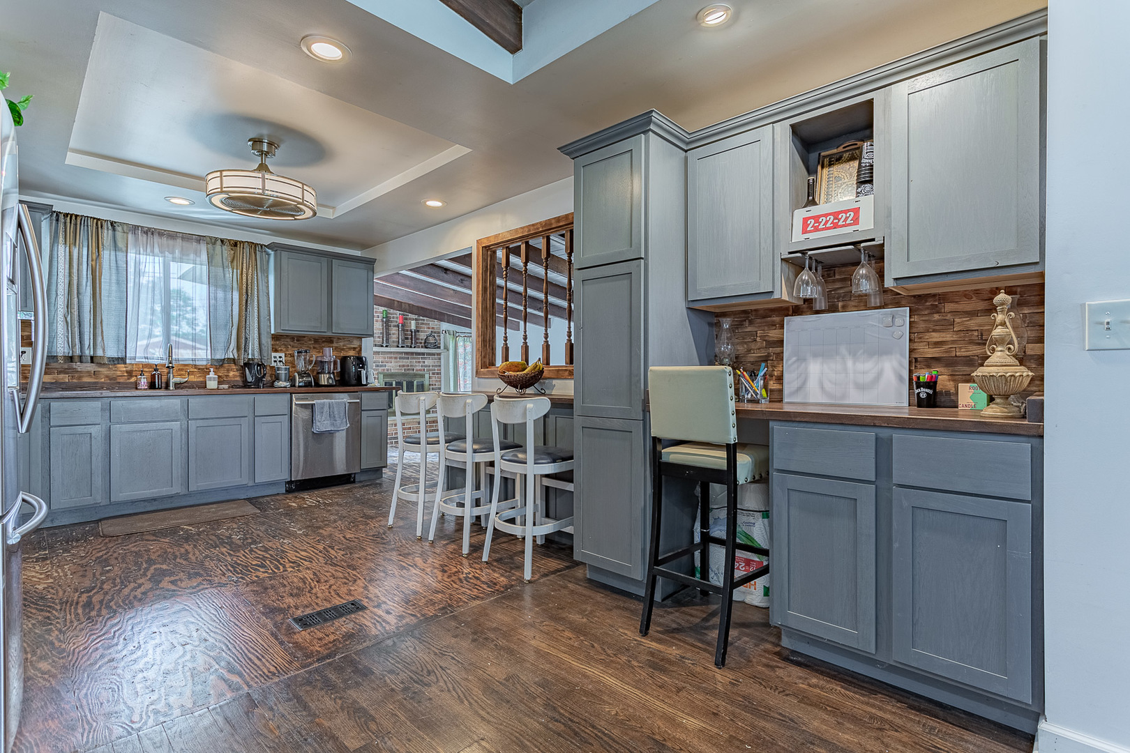 514 High Ridge Road Hillside, IL 60162 - Photo 6 of 24 a open kitchen with cabinets wooden floor and stainless steel appliances