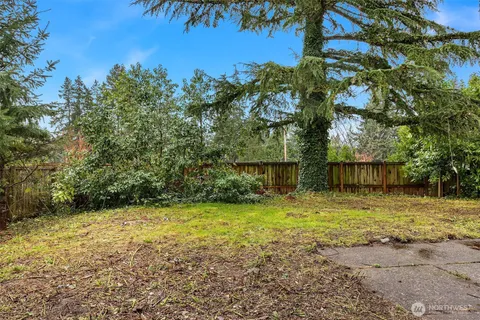 a backyard of a house with lots of green space