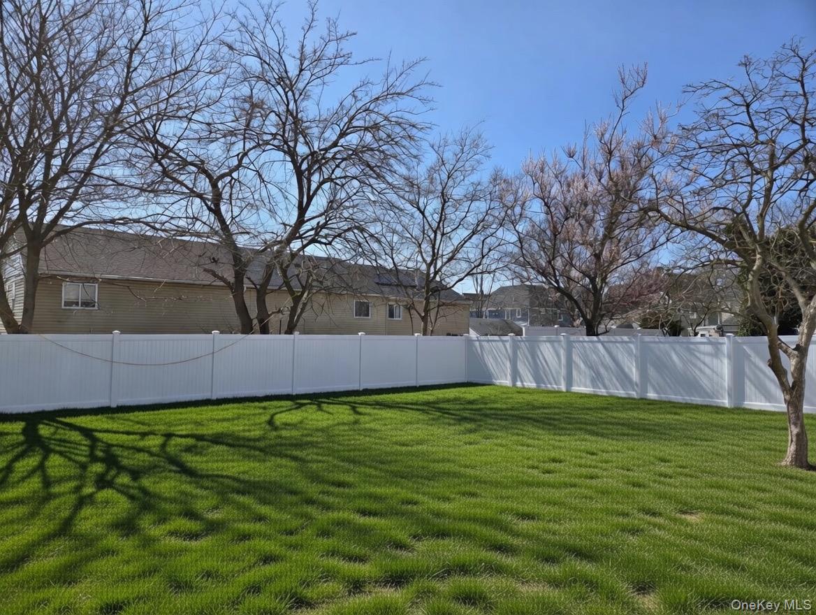 267 Morris Avenue Inwood, NY 11096 - Photo 2 of 10 a view of yard with trees