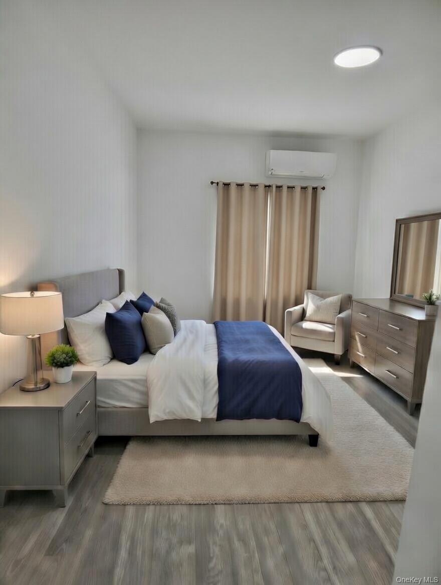 267 Morris Avenue Inwood, NY 11096 - Photo 10 of 10 a spacious bedroom with a bed and window