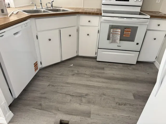 a utility room with cabinets