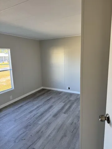 a view of an empty room and a window